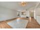 Spacious living room with beautiful hardwood floors, a modern ceiling light, and ample natural light at 11837 Meadowood Ln, Parker, CO 80138