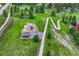 Aerial view showcasing a playground and a walking path within a grassy park at 11837 Meadowood Ln, Parker, CO 80138