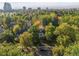 Beautiful aerial view showcasing lush tree coverage in a mature neighborhood with city views at 141 N Gilpin St, Denver, CO 80218