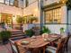 Beautifully landscaped backyard with patio and outdoor dining area, great for relaxing and entertaining at 141 N Gilpin St, Denver, CO 80218