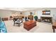 Finished basement offers space for recreation and relaxation, with a foosball table and fireplace at 141 N Gilpin St, Denver, CO 80218