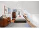 Bright bedroom with a sloped ceiling, a cozy rug, and a comfortable workstation at 141 N Gilpin St, Denver, CO 80218