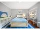 Well-lit bedroom boasts a blue geometric rug, ample storage, and a modern design at 141 N Gilpin St, Denver, CO 80218