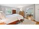 Bright bedroom showcases beautiful hardwood floors, a patterned rug, and multiple dressers at 141 N Gilpin St, Denver, CO 80218
