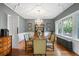 Elegant dining room with decorative ceiling, chandelier, and wainscoting at 141 N Gilpin St, Denver, CO 80218
