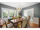 Dining area with large windows providing lots of natural light and hardwood flooring at 141 N Gilpin St, Denver, CO 80218