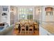 Eat-in nook with bench seating, wood table and chairs, and ample natural light at 141 N Gilpin St, Denver, CO 80218