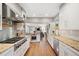 Modern kitchen with stainless steel appliances, granite countertops, and hardwood floors at 141 N Gilpin St, Denver, CO 80218