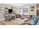 Bright living room boasts custom built-ins, comfortable seating, and a stylish area rug at 141 N Gilpin St, Denver, CO 80218