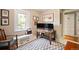 Office space with a wooden desk, area rug, and a bright window at 141 N Gilpin St, Denver, CO 80218