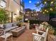 Outdoor patio area with comfortable seating, a fire pit, and string lights for evening ambiance at 141 N Gilpin St, Denver, CO 80218