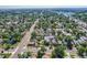 Discover the vibrant neighborhood from above, nestled amidst lush trees and showcasing a mix of charming homes and green spaces at 4883 Perry St, Denver, CO 80212