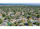 An aerial view shows the layout of this neighborhood with mature trees and houses at 4883 Perry St, Denver, CO 80212