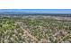 Get a bird's eye view of this quiet neighborhood with its tree-lined streets and well-maintained homes and lush greenery at 4883 Perry St, Denver, CO 80212