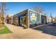 Exterior view of the Goldspot Brewing Company with a vibrant mural, inviting local residents at 4883 Perry St, Denver, CO 80212