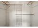 An empty closet with metal storage organizers for maximum storage and a light for illumination at 4883 Perry St, Denver, CO 80212