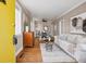 Inviting living room with hardwood floors, neutral decor, and ample natural light from the windows at 4883 Perry St, Denver, CO 80212