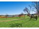 Picturesque view of Rocky Mountain Lake Park, a serene community space with walking paths and lake views at 4883 Perry St, Denver, CO 80212