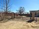 Decorative iron-gated property entrance with large metal property number plaque at 15460 Casler Ave, Fort Lupton, CO 80136