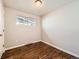 Bedroom featuring wood floors and one window at 170 W Midway Blvd, Broomfield, CO 80020