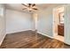 Bedroom featuring wood floors and an ensuite bathroom at 170 W Midway Blvd, Broomfield, CO 80020