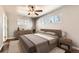 Serene bedroom featuring hardwood floors, neutral tones, and bright windows at 170 W Midway Blvd, Broomfield, CO 80020