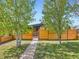 Home featuring a well-manicured front yard, horizontal fence, and a charming entryway path at 170 W Midway Blvd, Broomfield, CO 80020