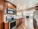 Kitchen featuring stainless steel appliances, granite countertops and an open layout at 170 W Midway Blvd, Broomfield, CO 80020
