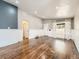 Bright, open living room featuring hardwood floors, wainscotting, and large windows with sheer curtains at 170 W Midway Blvd, Broomfield, CO 80020