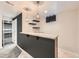 Finished basement wet bar area with granite countertop, floating shelves, and modern pendant lights at 170 W Midway Blvd, Broomfield, CO 80020