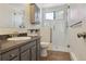 Updated bathroom with tiled shower and modern vanity at 1755 S Yampa Way, Aurora, CO 80017