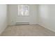 Bright bedroom with large window and plush carpeting at 1755 S Yampa Way, Aurora, CO 80017