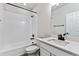 Bathroom with a shower/tub combo, toilet, and vanity with quartz countertop at 17751 E 93Rd Ave, Commerce City, CO 80022