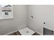 Laundry room with a drain, window, and space for washer/dryer hookups at 17751 E 93Rd Ave, Commerce City, CO 80022