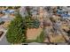 A lovely aerial view showing the home surrounded by mature trees and a large lot at 8060 Meade St, Westminster, CO 80031