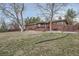 View of the brick house and backyard at 8060 Meade St, Westminster, CO 80031