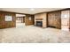 Finished basement with a brick fireplace and access to other rooms at 8060 Meade St, Westminster, CO 80031