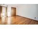 A sunlit bedroom with wood floors and a closet at 8060 Meade St, Westminster, CO 80031