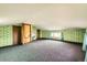 Bonus room features carpeted flooring, patterned wallpaper, and natural light at 8060 Meade St, Westminster, CO 80031