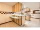 Kitchen features light colored cabinets and checkered tile backsplash at 8060 Meade St, Westminster, CO 80031