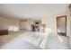 Bright and airy living room featuring a cozy fireplace and carpeted floors at 8060 Meade St, Westminster, CO 80031