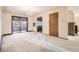 Spacious living room with a sliding glass door and carpeted floors at 8060 Meade St, Westminster, CO 80031