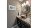 Charming powder room features a vessel sink, decorative mirror, and modern lighting at 6271 Mcintyre Way, Golden, CO 80403