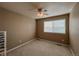 Simple bedroom has neutral paint, carpet floor, ceiling fan, and a bright window at 6271 Mcintyre Way, Golden, CO 80403