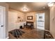 Welcoming entryway with bench seating, hardwood floors, and a view of the powder room at 6271 Mcintyre Way, Golden, CO 80403