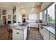 Modern kitchen with marble island, stainless steel appliances, and ample counter space at 6271 Mcintyre Way, Golden, CO 80403