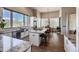 Bright kitchen boasts stainless appliances, marble countertops, and a spacious island with seating at 6271 Mcintyre Way, Golden, CO 80403