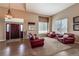Inviting living room with plush seating, a cozy rug, and a bright window, perfect for relaxing and entertaining guests at 6271 Mcintyre Way, Golden, CO 80403