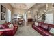 Expansive living room with hardwood floors, elegant furnishings, and a well-lit dining area, perfect for gatherings at 6271 Mcintyre Way, Golden, CO 80403