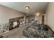 Second story living room area with high ceilings and wrought iron banister overlooks the rest of the house at 6271 Mcintyre Way, Golden, CO 80403